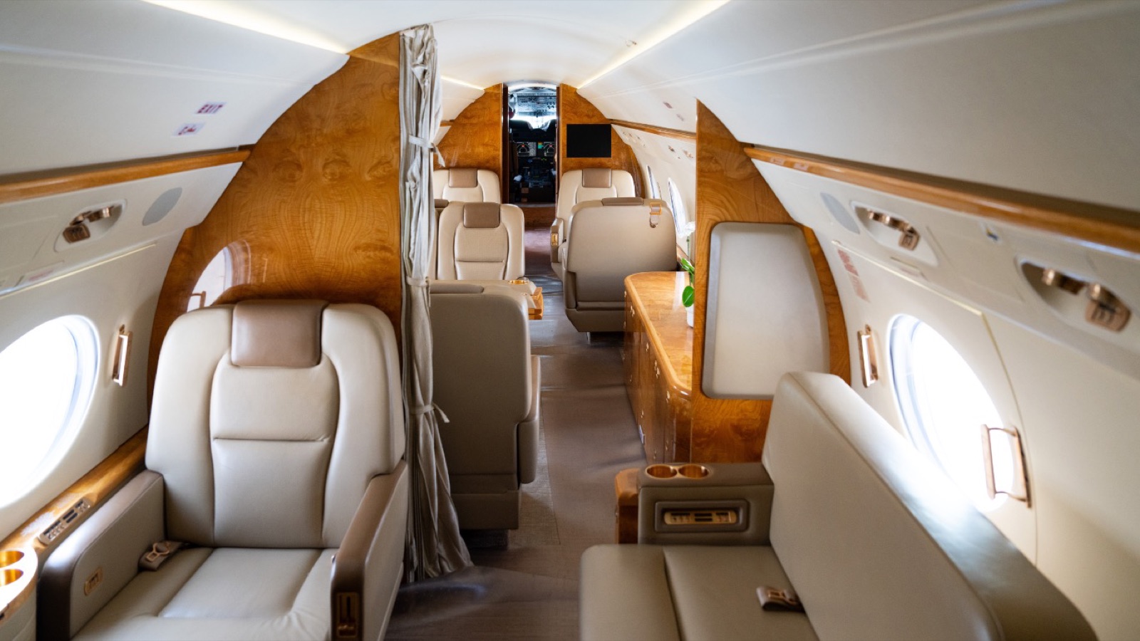 Gulfstream G450 aisle looking forward through three living zones toward the galley